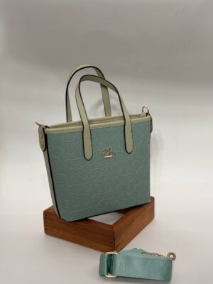 Coach Gofraj orta boy kova mint çanta