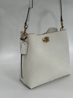 Coach Gofraj baskılı kilitli büzgülü beyaz çanta